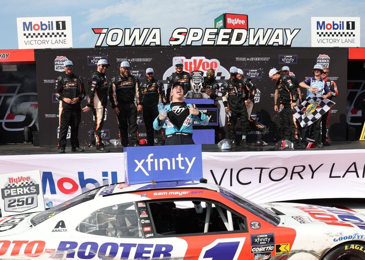Jun 15, 2024; Newton, Iowa, USA; NASCAR Xfinity Series driver Sam Mayer (1) celebrates his win at the Iowa Speedway. Mandatory Credit: Reese Strickland-USA TODAY Sports