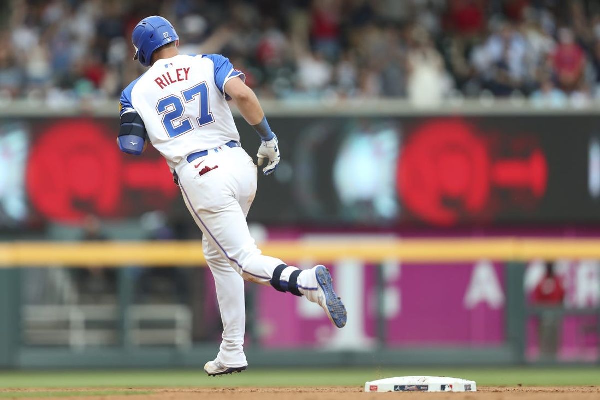 Jun 15, 2024; Cumberland, Georgia, USA; Atlanta Braves third baseman Austin Riley (27) hits a home run against the Tampa Bay Rays during the seventh inning at Truist Park. Mandatory Credit: Mady Mertens-USA TODAY Sports