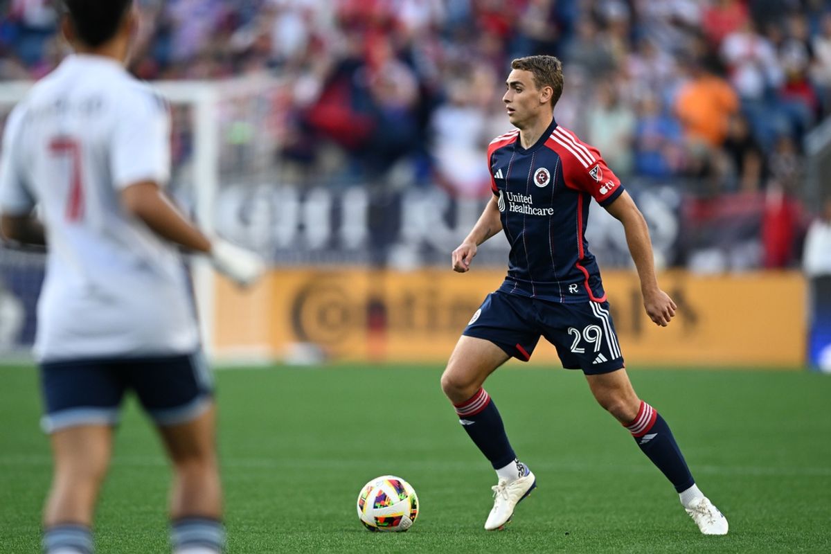 Jun 15, 2024; Foxborough, Massachusetts, USA;  New England Revolution midfielder Noel Buck (29) dribbles the ball against Vancouver Whitecaps FC during the first half at Gillette Stadium. Mandatory Credit: Mark Smith-USA TODAY Sports