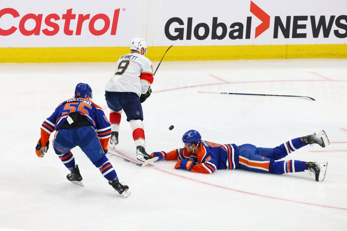 Florida Panthers center Sam Bennett (9) skates away form Edmonton Oilers left wing Dylan Holloway (55) and defenseman Philip Broberg (86) in the first period in game four of the 2024 Stanley Cup Final at Rogers Place. Mandatory Credit: Sergei Belski-USA TODAY Sports