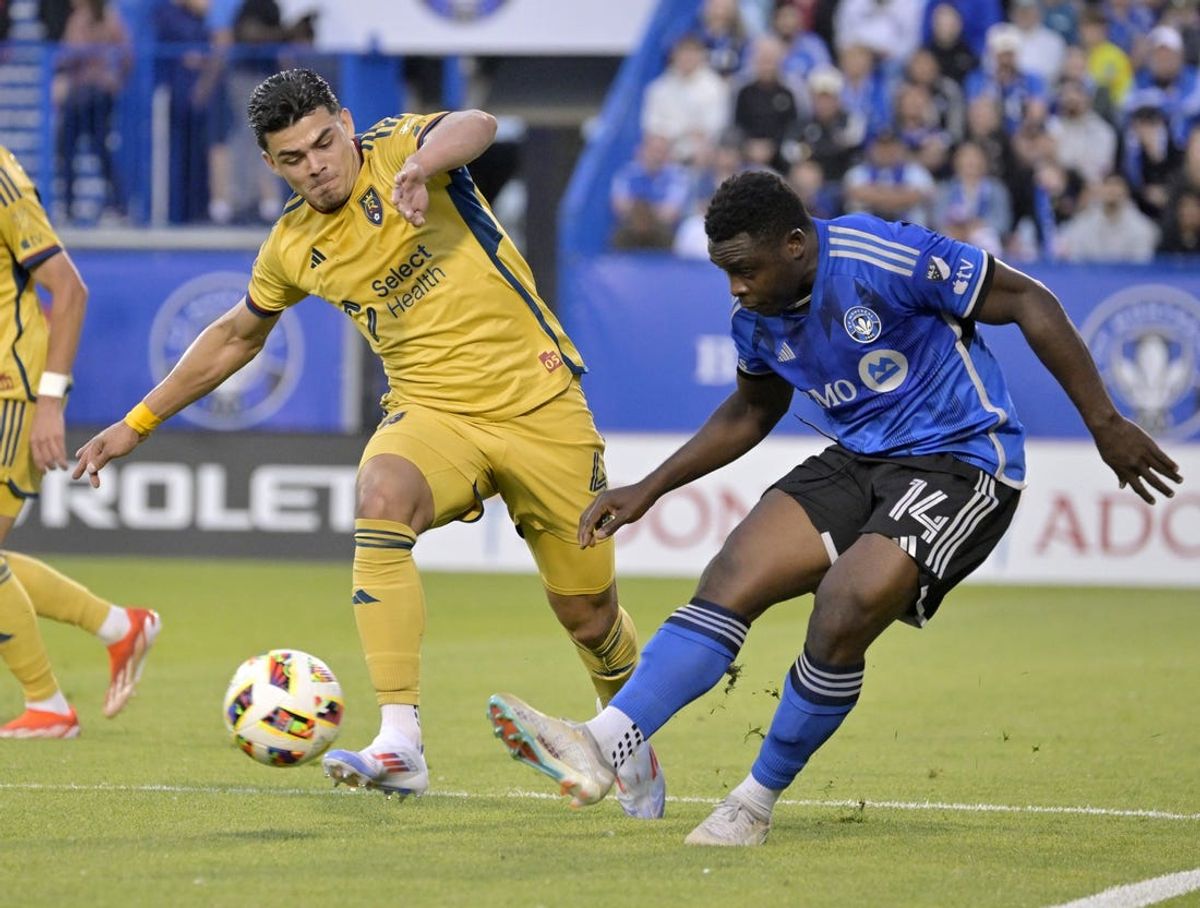 Jun 15, 2024; Montreal, Quebec, CAN; CF Montreal forward Sunusi Ibrahim (14) plays the ball and Real Salt Lake defender Brayan Vera (4) defends during the first half at Stade Saputo. Mandatory Credit: Eric Bolte-USA TODAY Sports