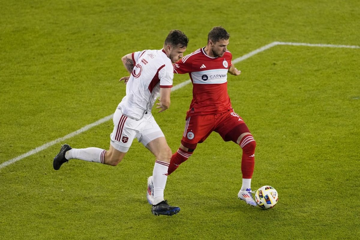 Jun 15, 2024; Toronto, Ontario, CAN; Chicago Fire FC forward Hugo Cuypers (9) controls the ball against Toronto FC defender Kevin Long (5) in the second half at BMO Field. Mandatory Credit: Kevin Sousa-USA TODAY Sports