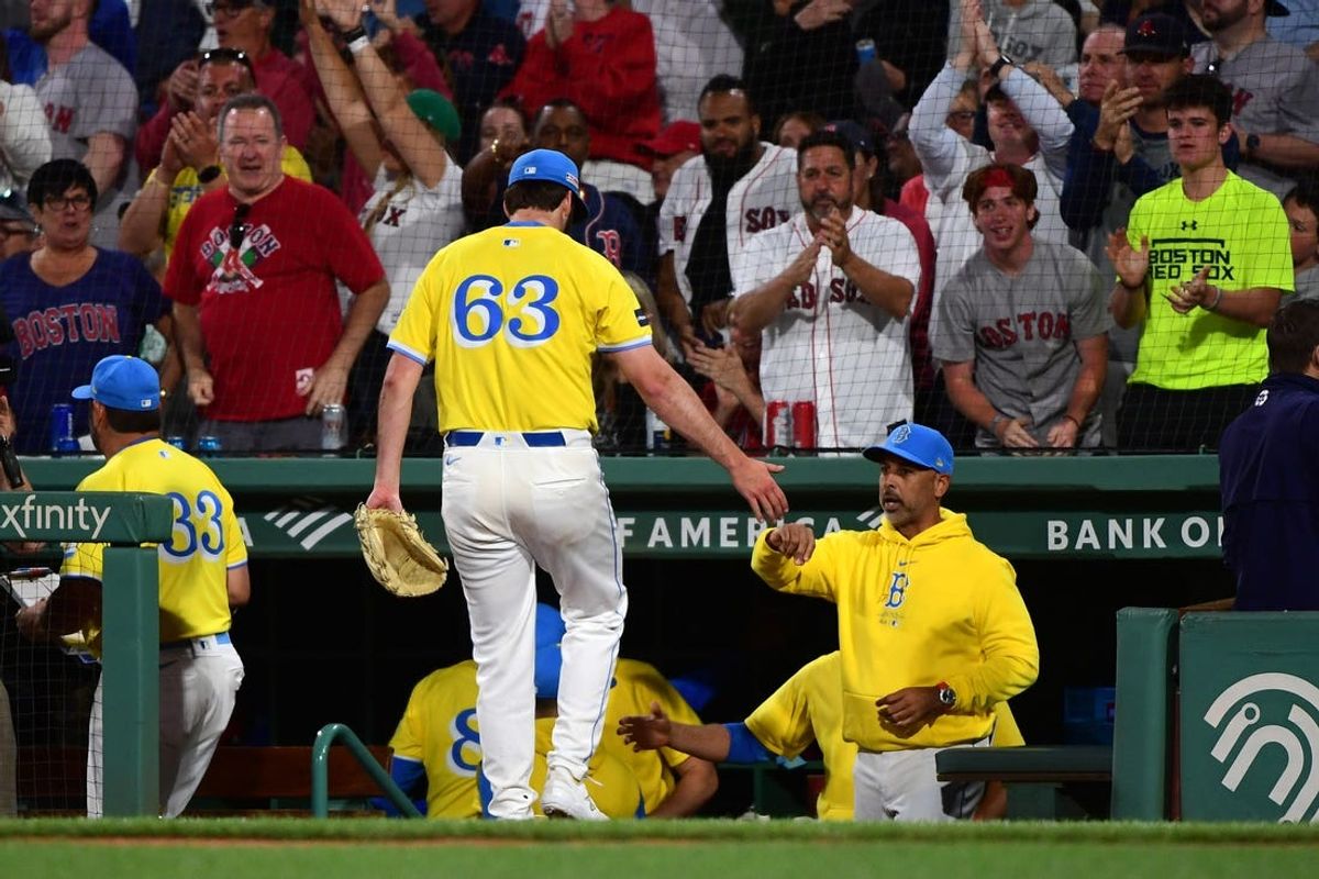 Jun 15, 2024; Boston, Massachusetts, USA;  Boston Red Sox relief pitcher Justin Slaten (63) is greeted by manager Alex Cora after pitching out of a jam during the fifth inning against the New York Yankees at Fenway Park. Mandatory Credit: Bob DeChiara-USA TODAY Sports