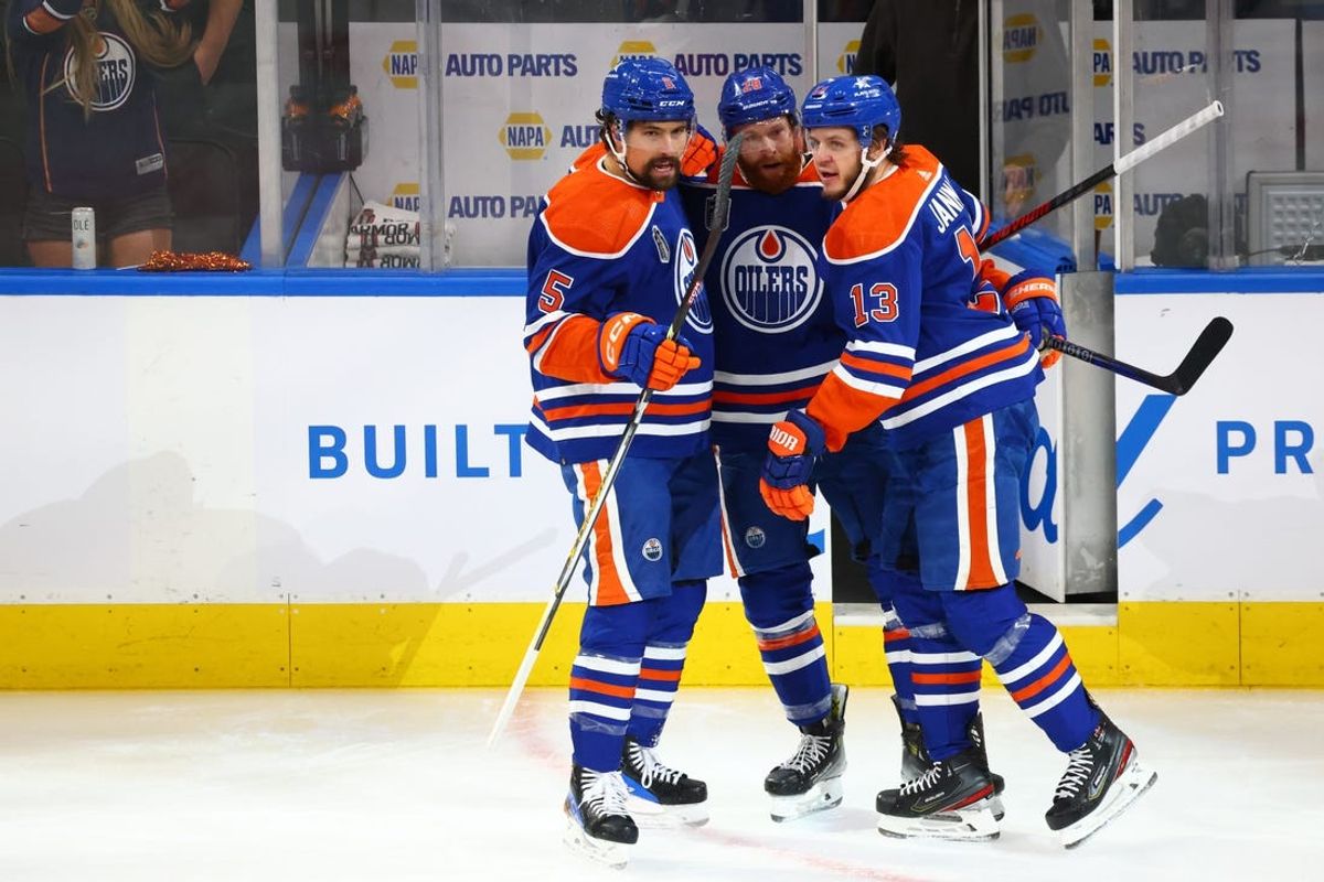 Jun 15, 2024; Edmonton, Alberta, CAN; Edmonton Oilers center Mattias Janmark (13) celebrates a goal with Edmonton Oilers defenseman Cody Ceci (5) right wing Connor Brown (28) in the first period against the Florida Panthers in game four of the 2024 Stanley Cup Final at Rogers Place. Mandatory Credit: Sergei Belski-USA TODAY Sports