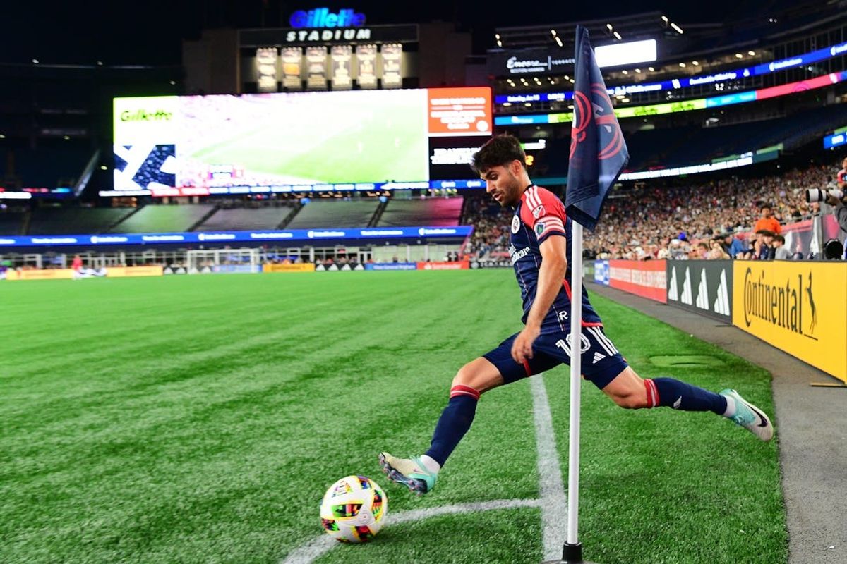 Jun 15, 2024; Foxborough, Massachusetts, USA;   New England Revolution midfielder Carles Gil (10) puts the ball into play on a corner kick against Vancouver Whitecaps FC during the second half at Gillette Stadium. Mandatory Credit: Eric Canha-USA TODAY Sports