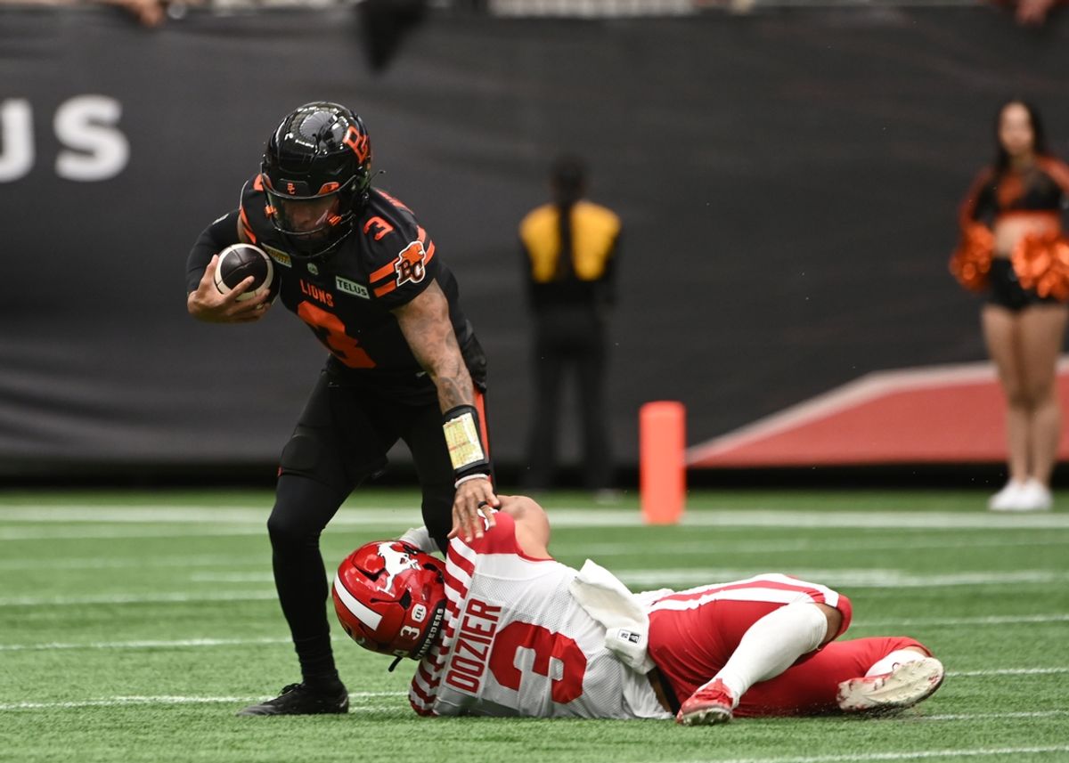Jun 15, 2024; Vancouver, British Columbia, CAN; BC Lions quarterback Vernon Adams Jr (3) makes a catch during the first half against Calgary Stampeders defensive back Branden Dozier (3) at BC Place. Mandatory Credit: Simon Fearn-USA TODAY Sports