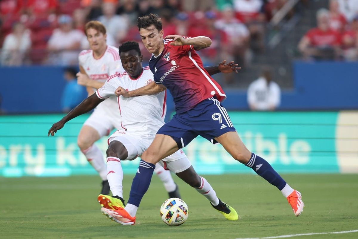 Jun 15, 2024; Frisco, Texas, USA; St. Louis CITY SC defender Josh Yaro (15) and FC Dallas forward Petar Musa (9) battle for the ball in the first hafl at Toyota Stadium. Mandatory Credit: Tim Heitman-USA TODAY Sports