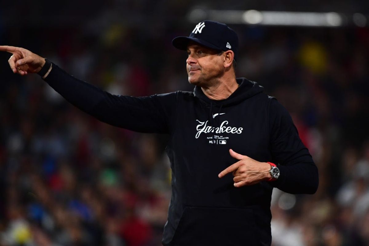 Jun 15, 2024; Boston, Massachusetts, USA;  New York Yankees manager Aaron Boone asks for a replay during the eighth inning against the Boston Red Sox at Fenway Park. Mandatory Credit: Bob DeChiara-USA TODAY Sports