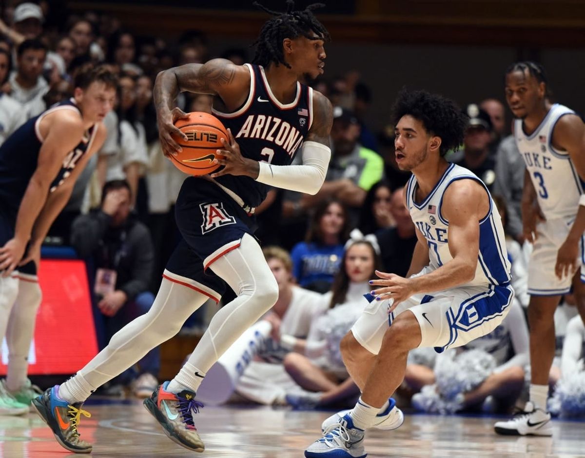 Nov 10, 2023; Durham, North Carolina, USA;  Arizona Wildcats guard Caleb Love (2) drives to the basket as Duke Blue Devils guard Jared McCain (0) defends during the second half at Cameron Indoor Stadium.