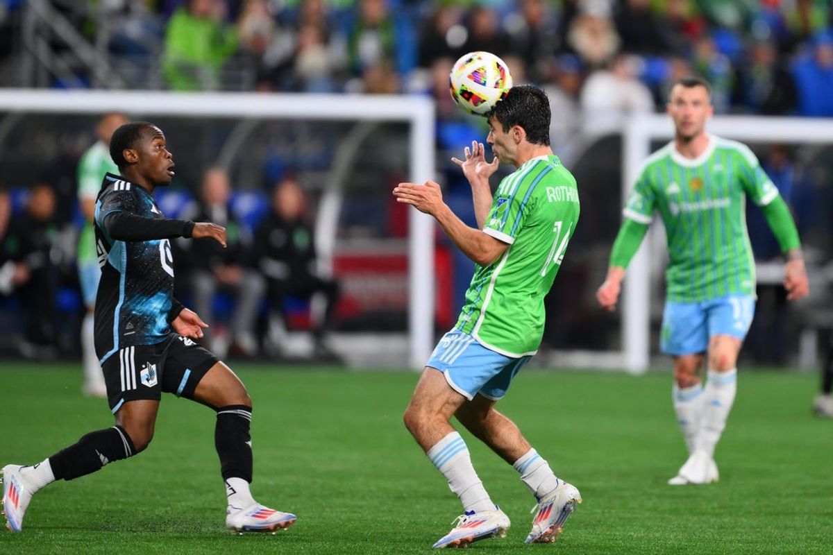Jun 15, 2024; Seattle, Washington, USA;  Seattle Sounders FC forward Paul Rothrock (14) heads the ball against Minnesota United during the second half at Lumen Field. Mandatory Credit: Steven Bisig-USA TODAY Sports