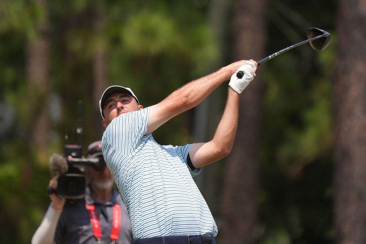 (File photo) Scottie Scheffler hits from the eighth tee box during the final round of the U.S. Open golf tournament. Mandatory Credit: Katie Goodale-USA TODAY Sports