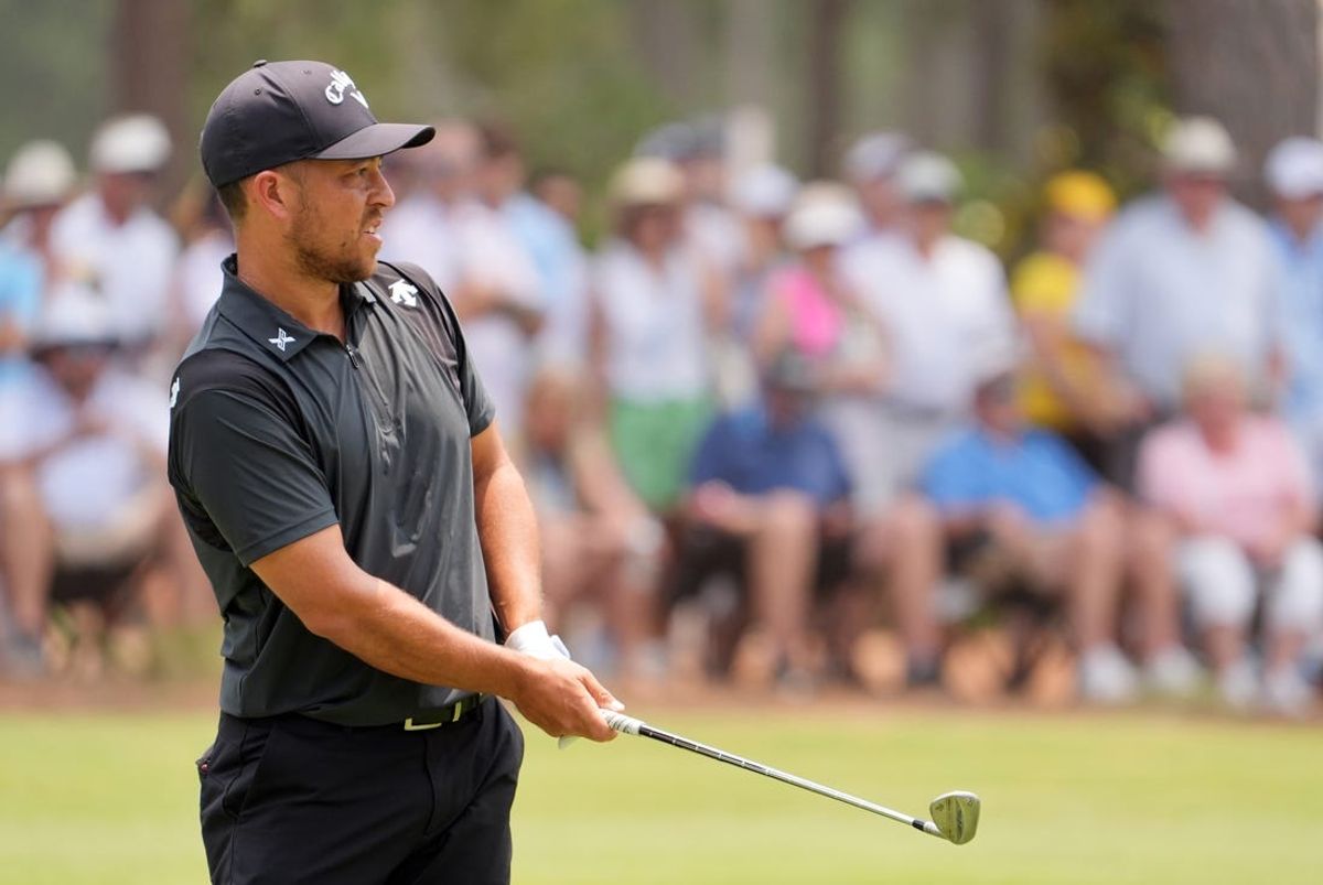 Jun 16, 2024; Pinehurst, North Carolina, USA; Xander Schauffele reacts after a chip on the first hole during the final round of the U.S. Open golf tournament. Mandatory Credit: John David Mercer-USA TODAY Sports