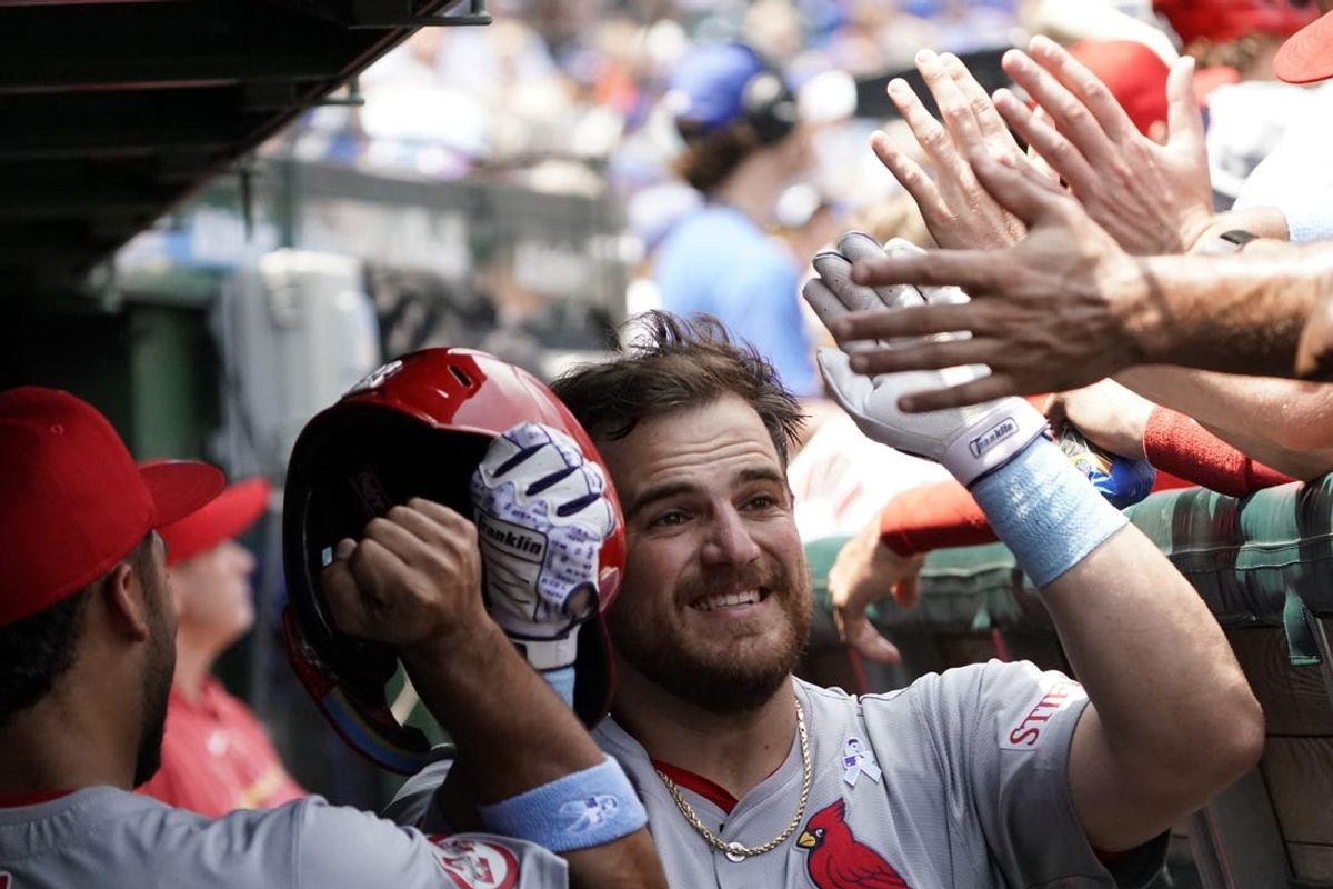 Jun 16, 2024; Chicago, Illinois, USA; St. Louis Cardinals catcher Pedro Pagés (43) is greeted in the dugout after hitting a two-run home run against the Chicago Cubs during the second inning at Wrigley Field. Mandatory Credit: David Banks-USA TODAY Sports