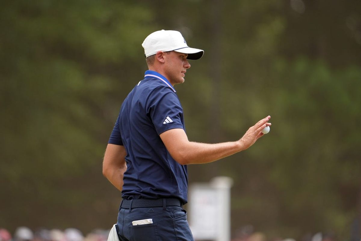 Jun 16, 2024; Pinehurst, North Carolina, USA; Ludvig Aberg acknowledges the gallery on the first green during the final round of the U.S. Open golf tournament. Mandatory Credit: John David Mercer-USA TODAY Sports