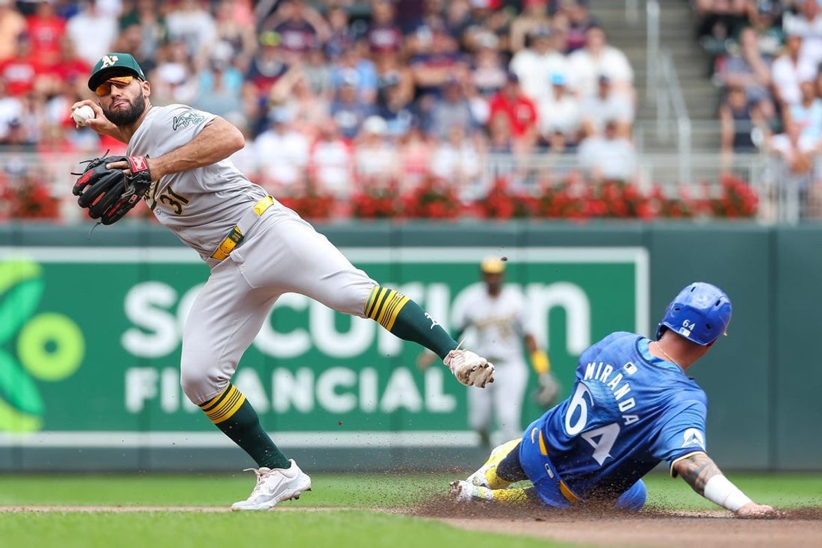 Jun 16, 2024; Minneapolis, Minnesota, USA; Oakland Athletics second baseman Abraham Toro (31) attempts a double play on a fielders choice hit by Minnesota Twins catcher Ryan Jeffers (27) during the first inning of game one of a double header at Target Field. Mandatory Credit: Matt Krohn-USA TODAY Sports
