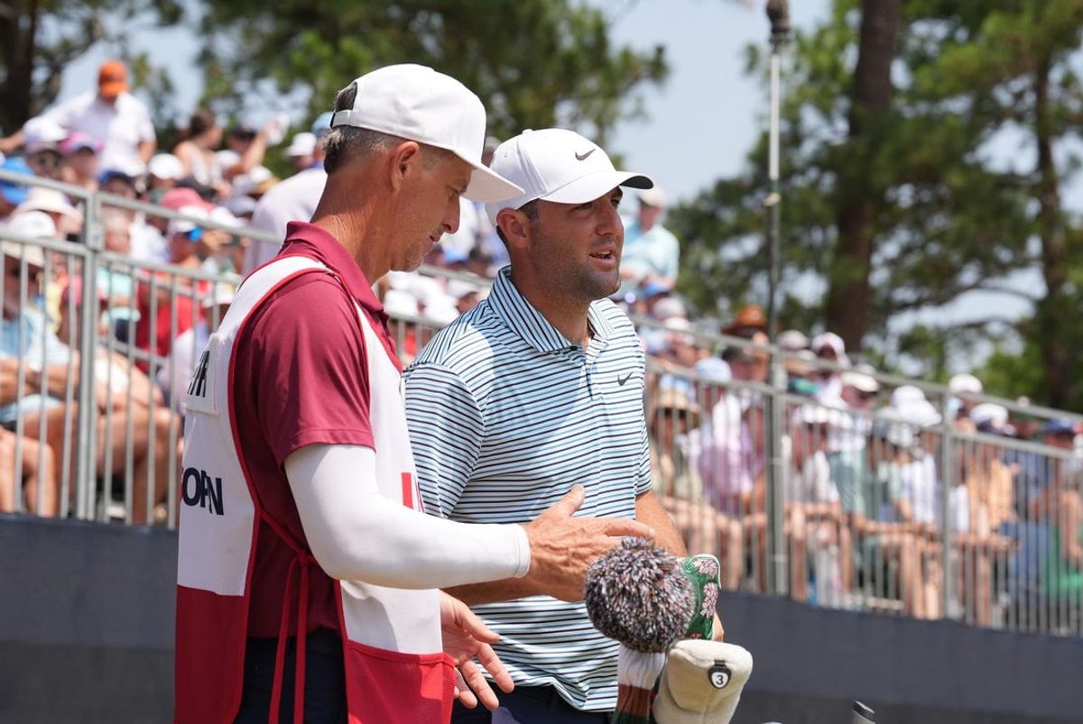 Jun 16, 2024; Pinehurst, North Carolina, USA; Scottie Scheffler talks with his caddie Ted Scott on the seventh green during the final round of the U.S. Open golf tournament. Mandatory Credit: Katie Goodale-USA TODAY Sports