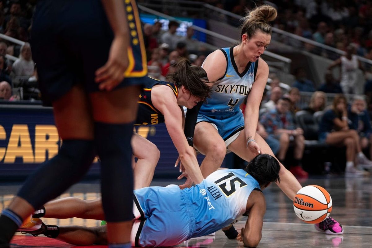 Chicago Sky guard Marina Mabrey (4), Chicago Sky guard Lindsay Allen (15) and Indiana Fever guard Caitlin Clark (22) reach for a loose ball on Sunday June 16, 2024, during the game at Gainbridge Fieldhouse in Indianapolis. The Fever beat the Sky 91-83.