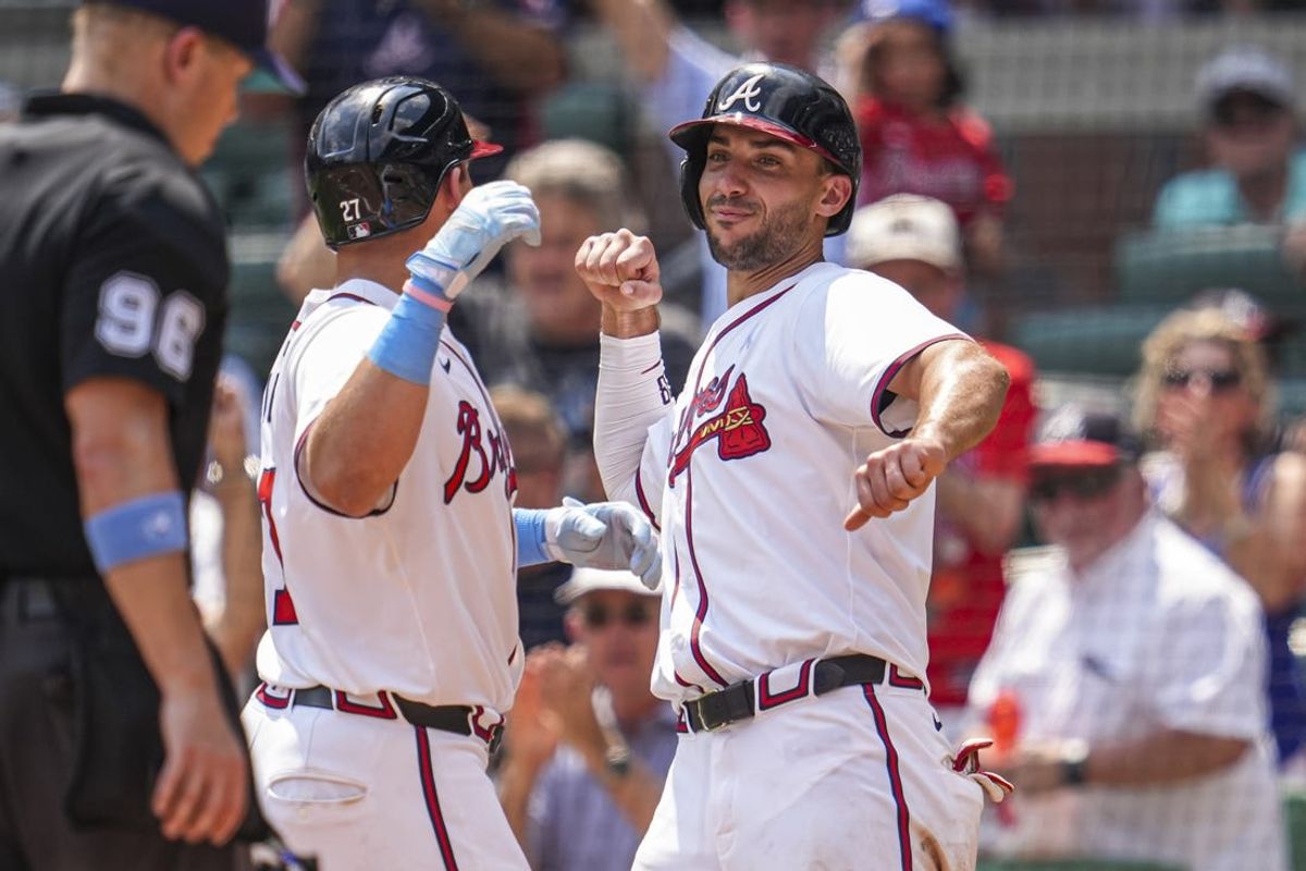 Jun 16, 2024; Cumberland, Georgia, USA; Atlanta Braves third baseman Austin Riley (27) reacts with first baseman Matt Olson (28) after hitting a game tying two run home run against the Tampa Bay Rays during the eighth inning at Truist Park. Mandatory Credit: Dale Zanine-USA TODAY Sports