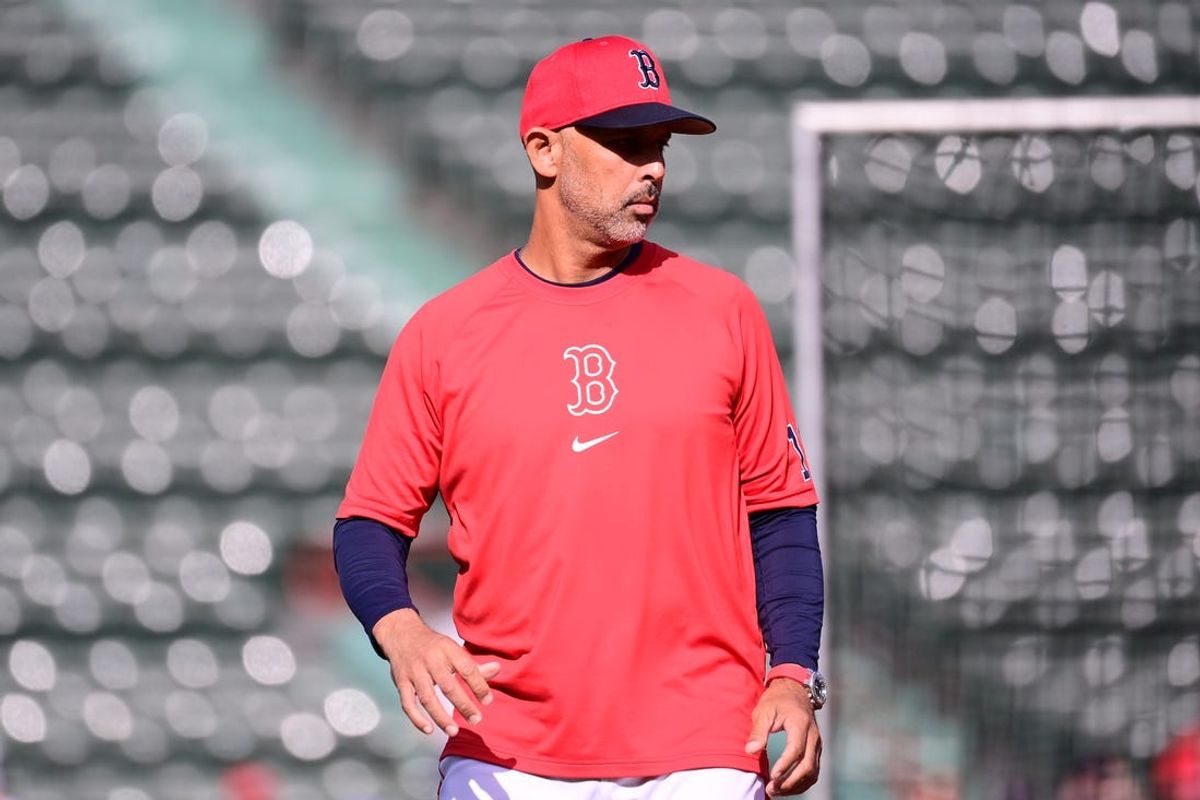 Jun 16, 2024; Boston, Massachusetts, USA;  Boston Red Sox manager Alex Cora (13) watches the team warmup before a game against the New York Yankees at Fenway Park. Mandatory Credit: Eric Canha-USA TODAY Sports