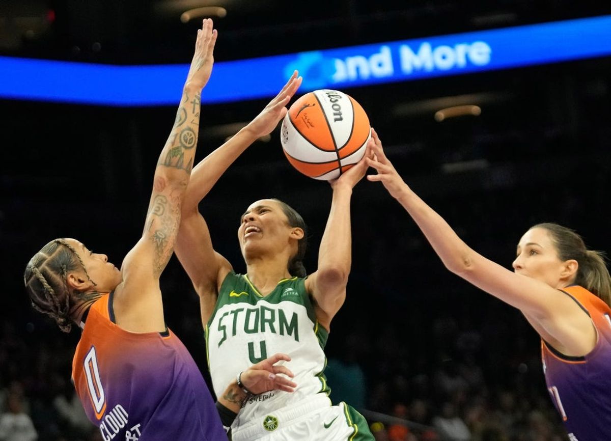 Seattle Storm guard Skylar Diggins-Smith (4) is defended by Phoenix Mercury guards Natasha Cloud (0) and Rebecca Allen (11) during the first quarter at Footprint Center in Phoenix on Sunday, June 16, 2024.