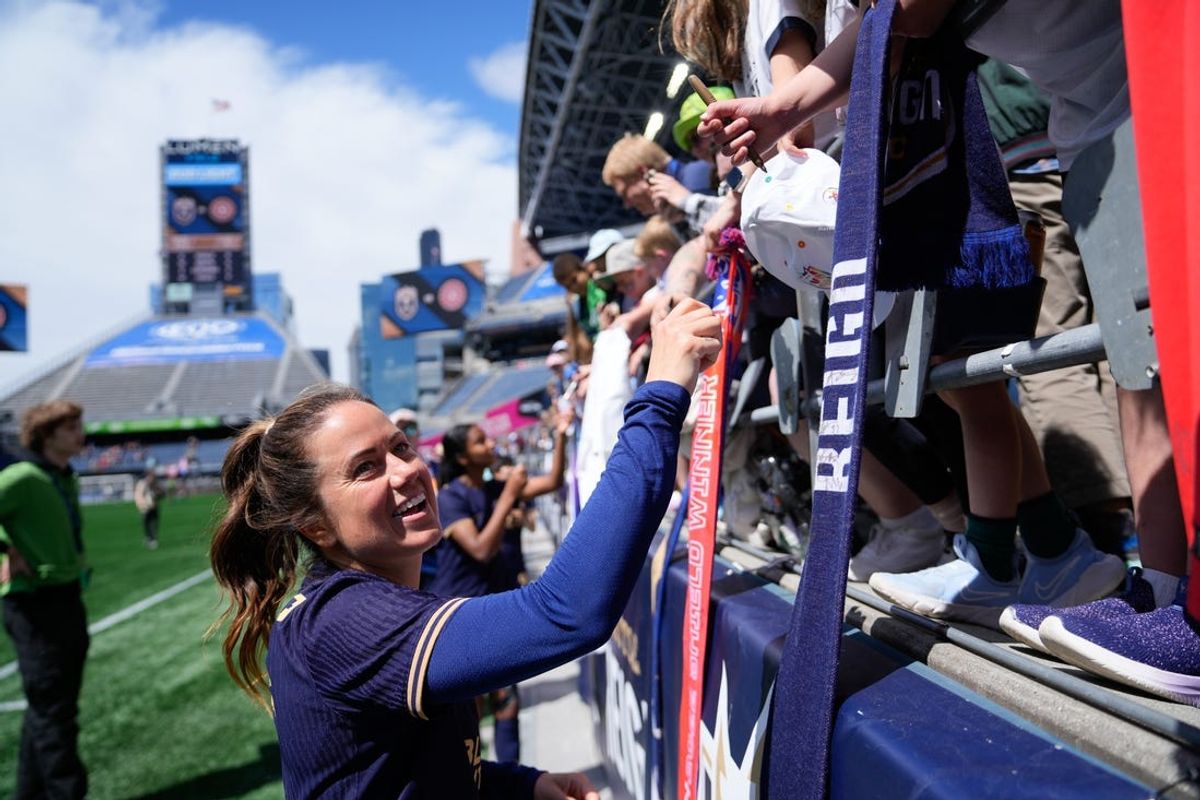 Jun 16, 2024; Seattle, Washington, USA; Seattle Reign FC defender Lauren Barnes (3) signs autographs after the game against Portland Thorns FC at Lumen Field. Mandatory Credit: Stephen Brashear-USA TODAY Sports