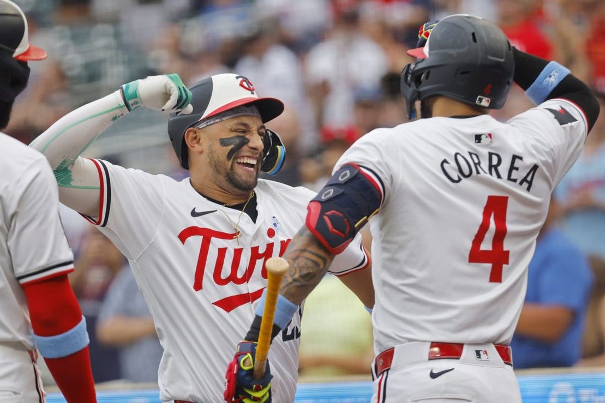 Jun 16, 2024; Minneapolis, Minnesota, USA; Minnesota Twins third baseman Royce Lewis (23) celebrates his three-run home run with shortstop Carlos Correa (4) against the Oakland Athletics in the first inning of game two of a double header at Target Field. Mandatory Credit: Bruce Kluckhohn-USA TODAY Sports