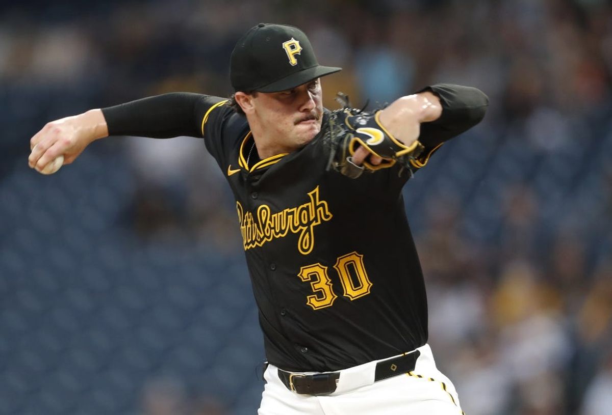 Jun 17, 2024; Pittsburgh, Pennsylvania, USA;  Pittsburgh Pirates starting pitcher Paul Skenes (30) delivers a pitch against the Cincinnati Reds during the first inning at PNC Park. Mandatory Credit: Charles LeClaire-USA TODAY Sports