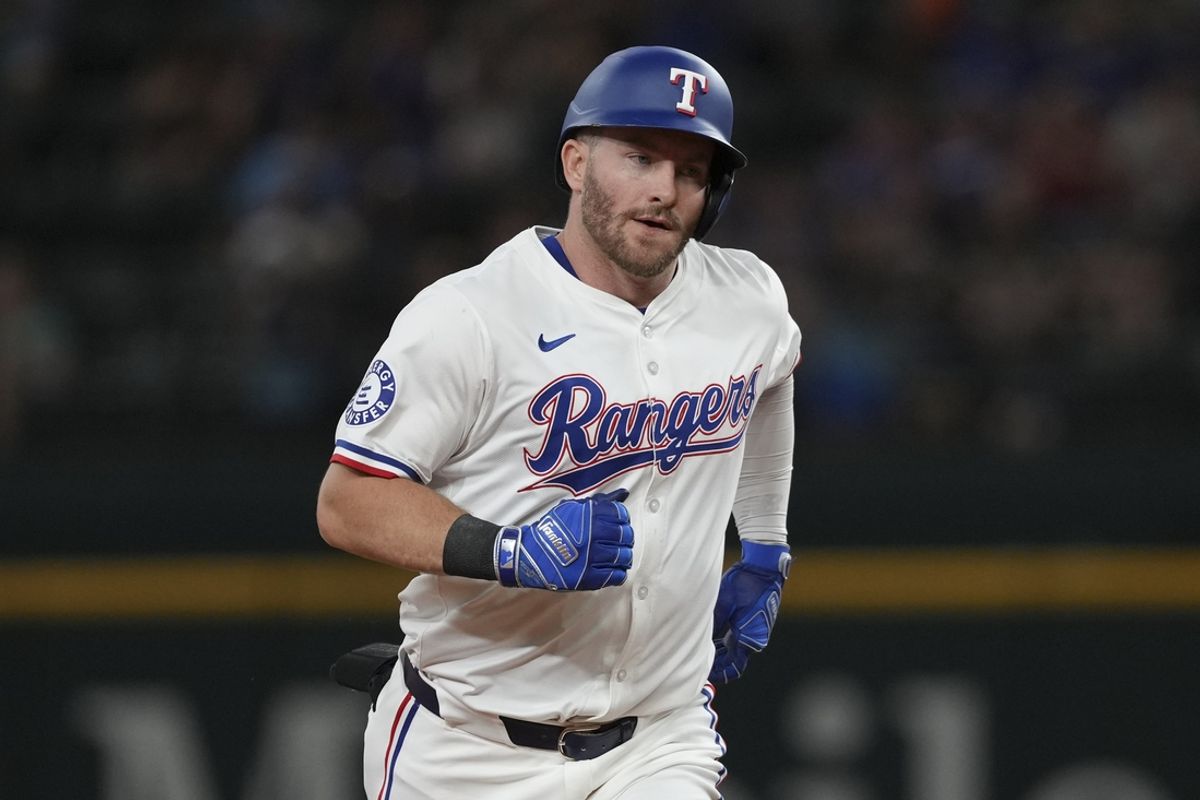 Jun 17, 2024; Arlington, Texas, USA; Texas Rangers designated hitter Robbie Grossman (4) circles the bases on his two-run home run against the New York Mets during the third inning at Globe Life Field. Mandatory Credit: Jim Cowsert-USA TODAY Sports