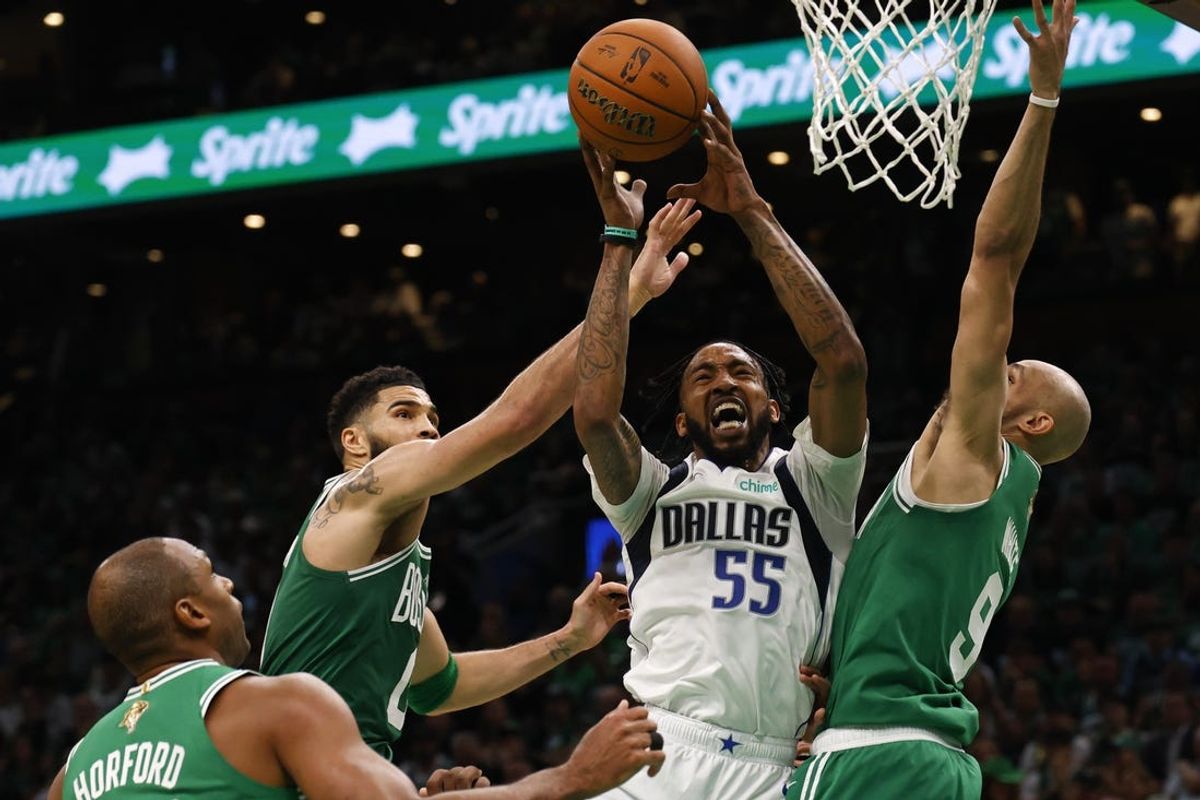 Jun 17, 2024; Boston, Massachusetts, USA; Dallas Mavericks forward Derrick Jones Jr. (55) loses control of the ball against Boston Celtics forward Jayson Tatum (left) and guard Derrick White (9) during the second quarter in game five of the 2024 NBA Finals at TD Garden. Mandatory Credit: Peter Casey-USA TODAY Sports