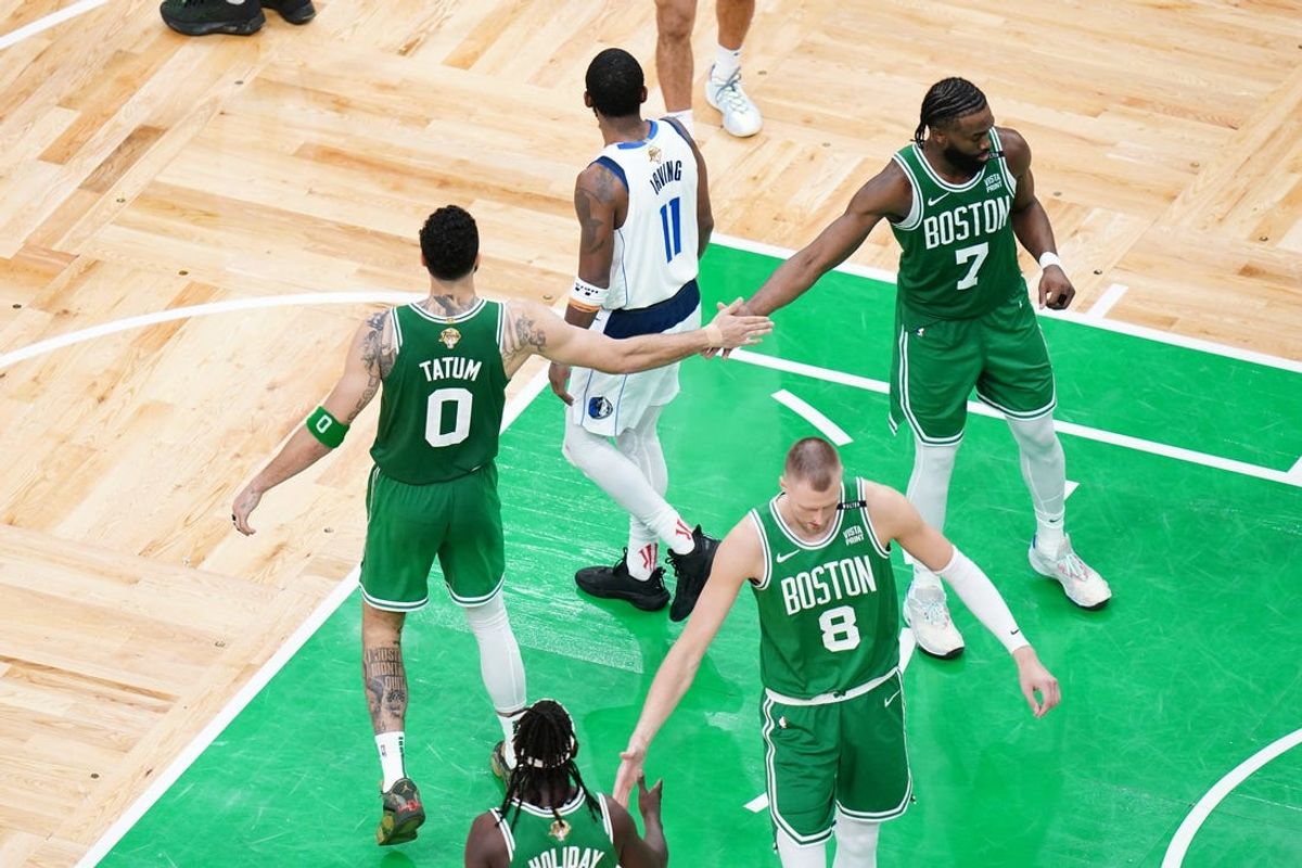Jun 17, 2024; Boston, Massachusetts, USA; Boston Celtics forward Jayson Tatum (0) reacts with guard Jaylen Brown (7) in the fourth quarter against the Dallas Mavericks during game five of the 2024 NBA Finals at TD Garden. Mandatory Credit: David Butler II-USA TODAY Sports