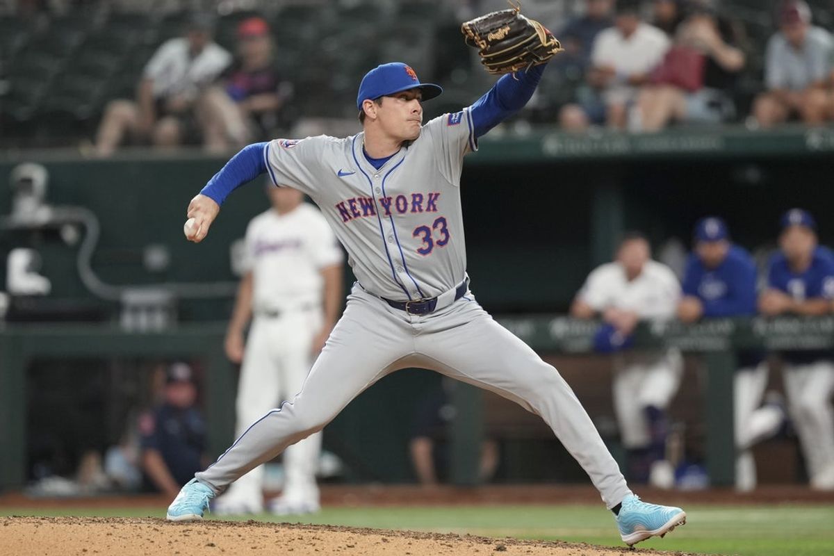 Jun 17, 2024; Arlington, Texas, USA; New York Mets relief pitcher Drew Smith (33) delivers a pitch to the Texas Rangers during the ninth inning at Globe Life Field. Mandatory Credit: Jim Cowsert-Imagn Images