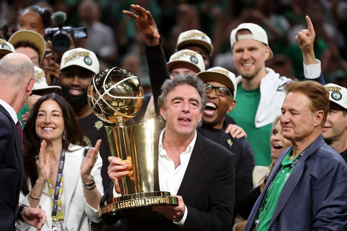 Jun 17, 2024; Boston, Massachusetts, USA; Boston Celtics owner Wyc Grousbeck holds the trophy after winning the 2024 NBA Finals against the Dallas Mavericks at TD Garden. Mandatory Credit: Peter Casey-USA TODAY Sports