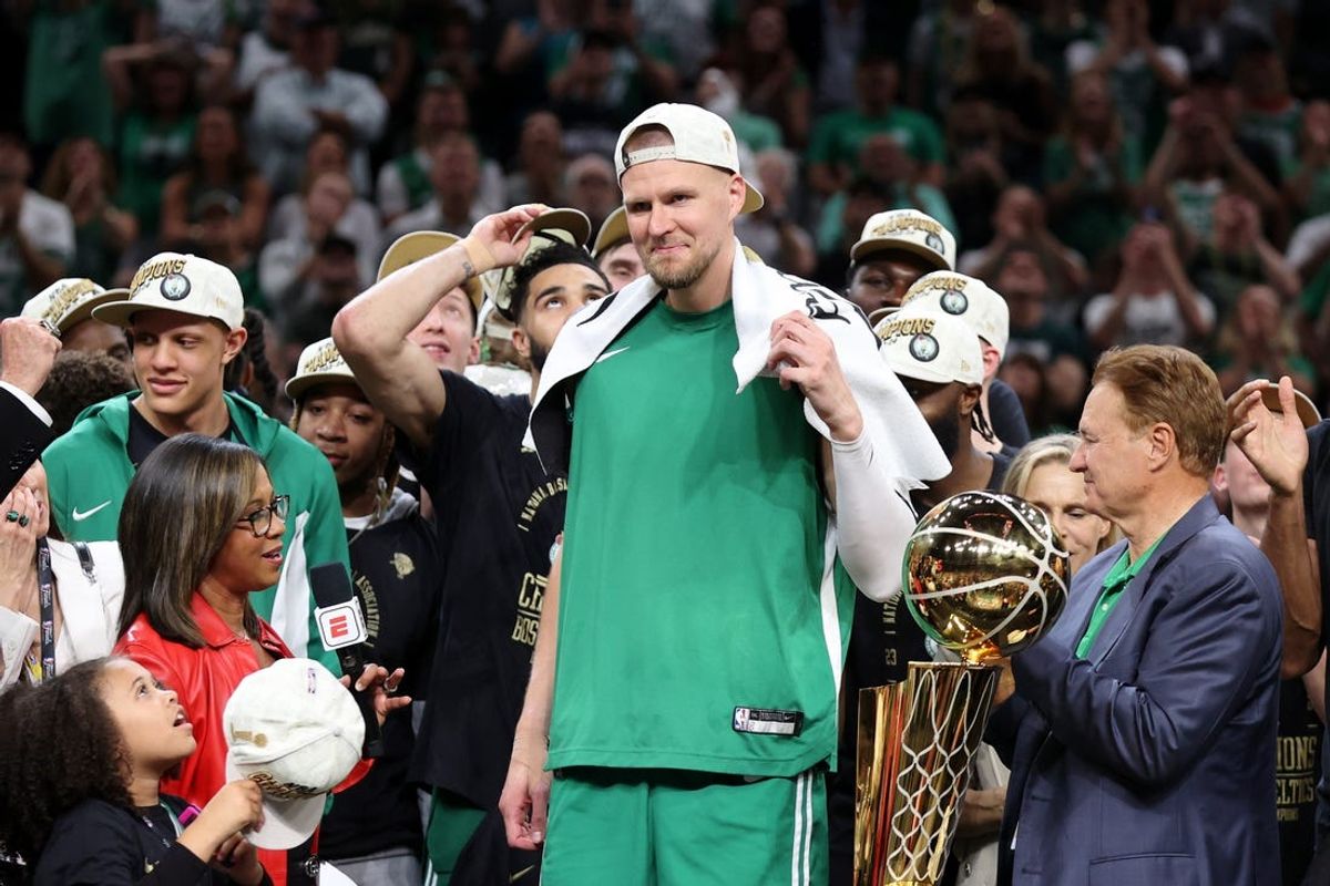 Jun 17, 2024; Boston, Massachusetts, USA; Boston Celtics center Kristaps Porzingis (8) celebrates after winning the 2024 NBA Finals against the Dallas Mavericks at TD Garden. Mandatory Credit: Peter Casey-USA TODAY Sports