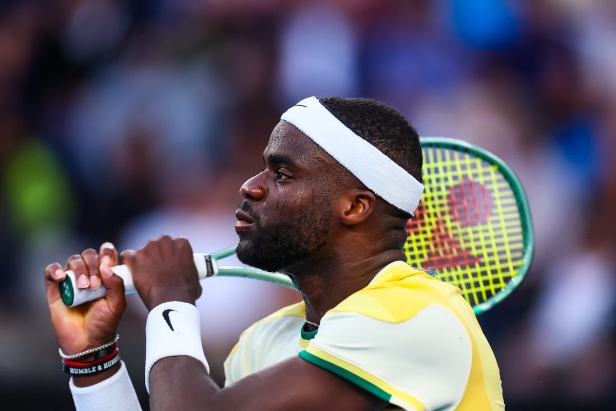 Jan 17, 2024; Melbourne, Victoria, Australia; Frances Tiafoe of the United States plays a shot against Tomas Machac (not pictured) of Czechia in Round 2 of the Men's Singles on Day 4 of the Australian Open tennis at Kia Arena.