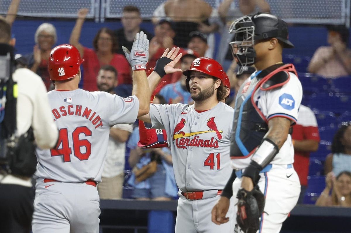 Jun 18, 2024; Miami, Florida, USA; St. Louis Cardinals first baseman Paul Goldschmidt (46) is greeted at the plate by right fielder teammate Alec Burleson (41) after his two run home run against the Miami Marlins in the first inning at loanDepot Park. Mandatory Credit: Rhona Wise-USA TODAY Sports