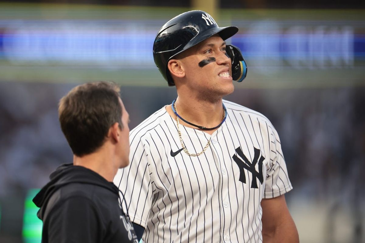 Jun 18, 2024; Bronx, New York, USA; New York Yankees center fielder Aaron Judge (99) reacts after being hit by a pitch during the third inning against the Baltimore Orioles at Yankee Stadium. Mandatory Credit: Vincent Carchietta-USA TODAY Sports