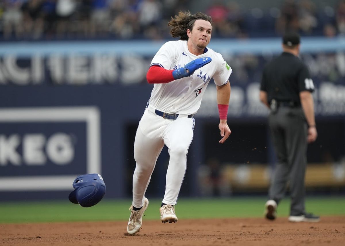 Jun 18, 2024; Toronto, Ontario, CAN; Toronto Blue Jays right fielder Addison Barger (47) heads to third base to score on a single by third baseman Ernie Clement (not pictured) against the Boston Red Sox during the second inning at Rogers Centre. Mandatory Credit: John E. Sokolowski-USA TODAY Sports