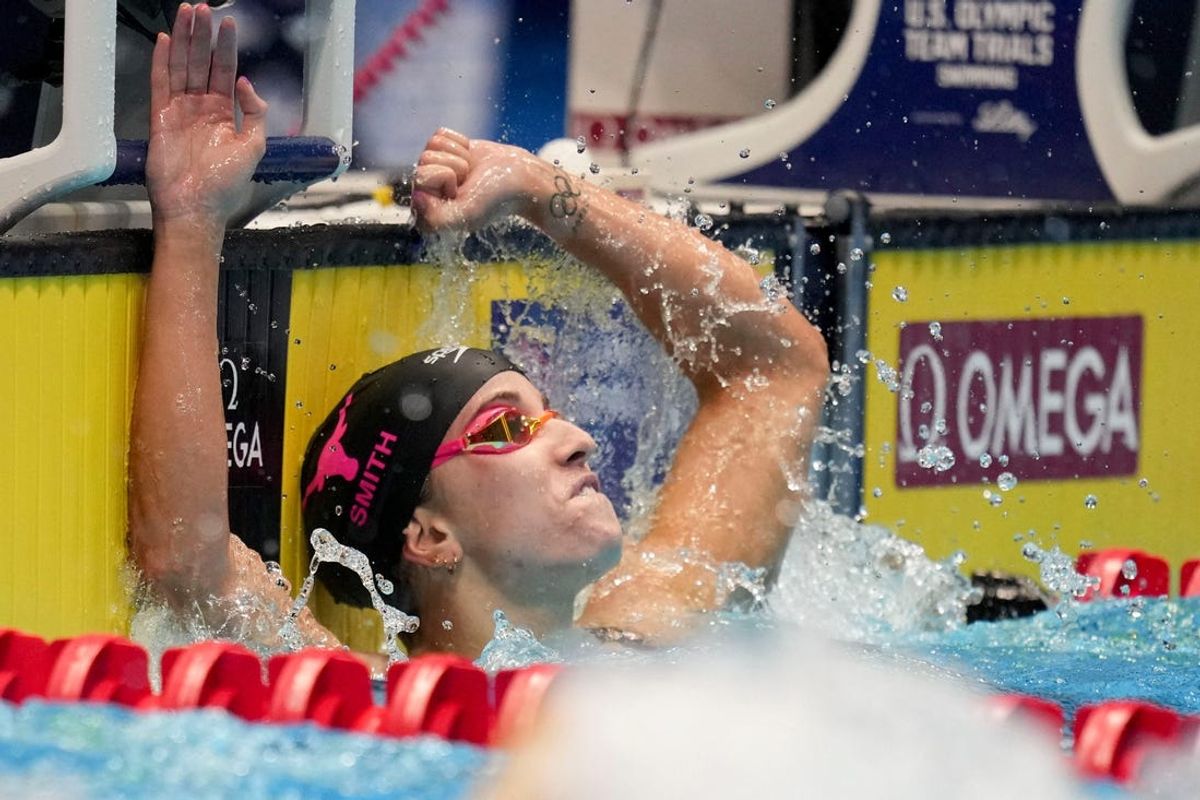 Regan Smith reacts after winning the 100-meter backstroke final while setting a world record Tuesday, June 18, 2024, during the fourth day of competition for the U.S. Olympic Team Swimming Trials at Lucas Oil Stadium in Indianapolis.