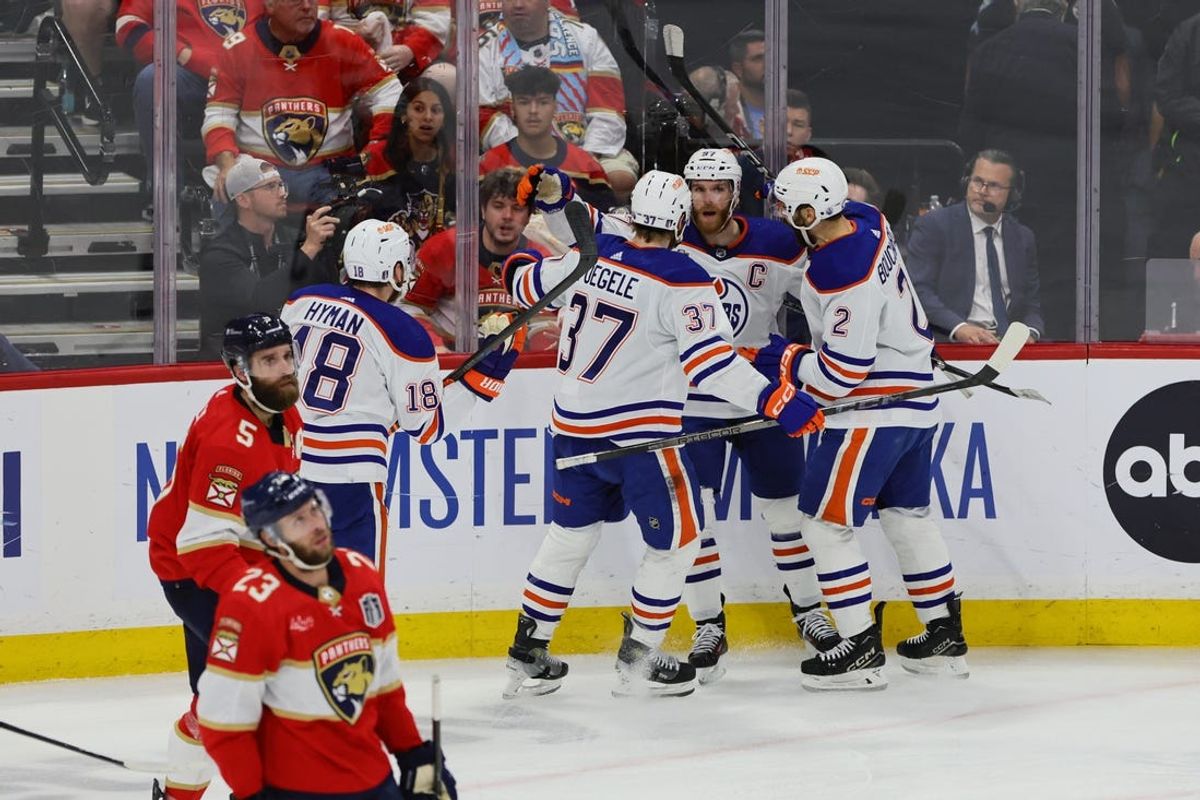 Jun 18, 2024; Sunrise, Florida, USA; Edmonton Oilers forward Connor McDavid (97) celebrates scoring against the Florida Panthers with forward Warren Foegele (37) and defenseman Evan Bouchard (2) and forward Zach Hyman (18) during the second period in game five of the 2024 Stanley Cup Final at Amerant Bank Arena. Mandatory Credit: Sam Navarro-USA TODAY Sports