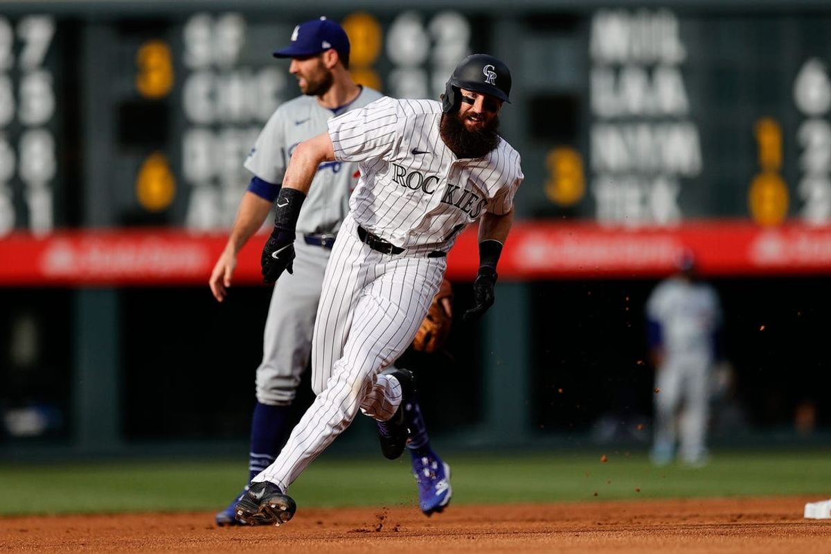 Jun 18, 2024; Denver, Colorado, USA; Colorado Rockies designated hitter Charlie Blackmon (19) runs to third in the first inning against the Los Angeles Dodgers at Coors Field. Mandatory Credit: Isaiah J. Downing-USA TODAY Sports
