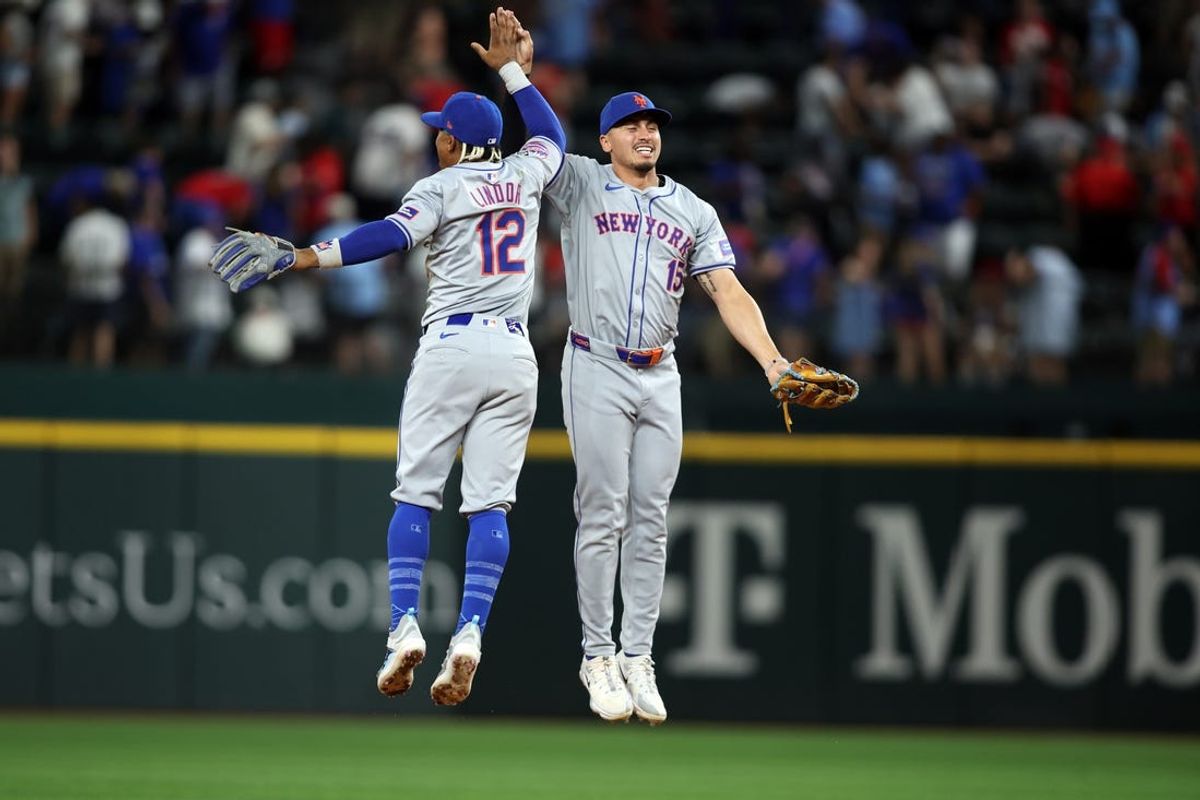 Jun 18, 2024; Arlington, Texas, USA; New York Mets shortstop Francisco Lindor (12) and center fielder Tyrone Taylor (15) celebrate after the game against the Texas Rangers at Globe Life Field. Mandatory Credit: Tim Heitman-USA TODAY Sports