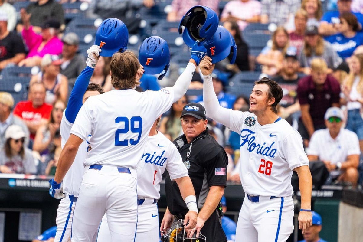 Jun 19, 2024; Omaha, NE, USA; Florida Gators designated hitter Brody Donay (29) celebrates with right fielder Ashton Wilson (30), third baseman Dale Thomas (1) and catcher Luke Heyman (28) after hitting a grand slam against the Kentucky Wildcats during the first inning at Charles Schwab Field Omaha. Mandatory Credit: Dylan Widger-USA TODAY Sports