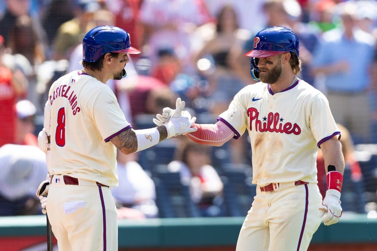 Jun 19, 2024; Philadelphia, Pennsylvania, USA; Philadelphia Phillies first base Bryce Harper (3) celebrates with outfielder Nick Castellanos (8) after hitting a home run during the eighth inning against the San Diego Padres at Citizens Bank Park. Mandatory Credit: Bill Streicher-USA TODAY Sports