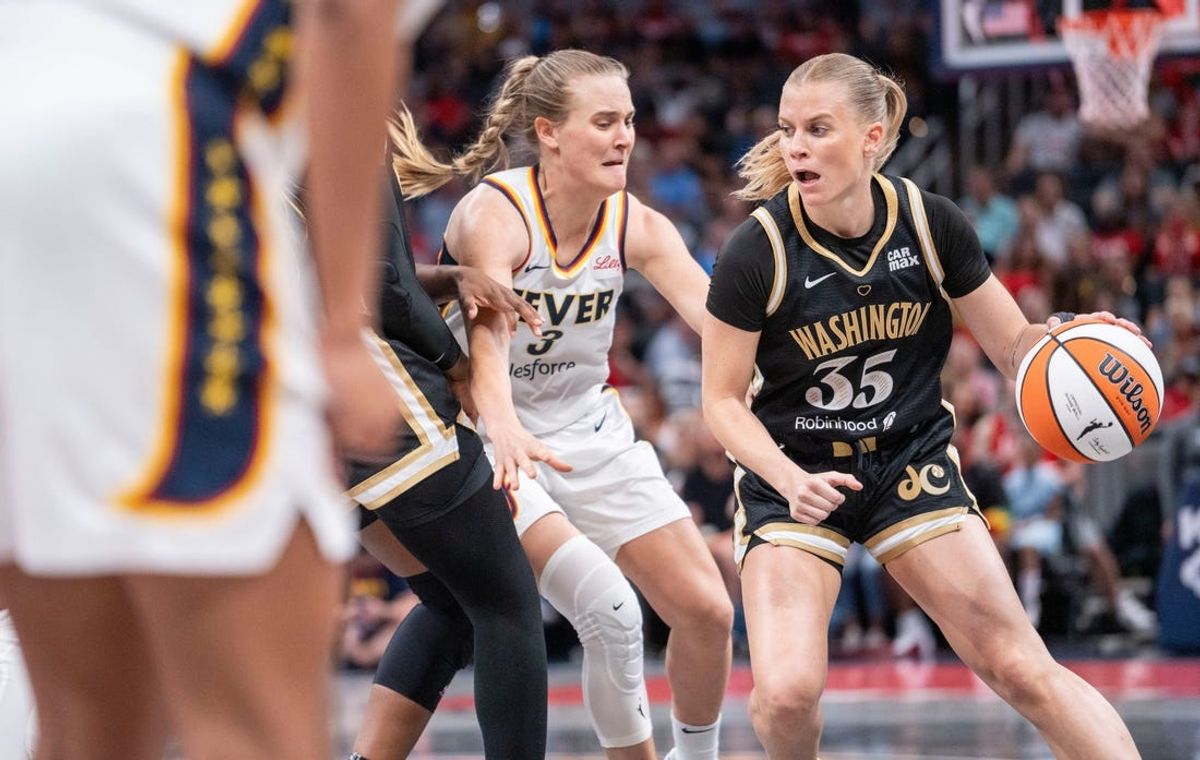 Indiana Fever guard Kristy Wallace (3) scrambles for the ball against Washington Mystics guard Julie Vanloo (35) Wednesday, June 19, 2024, during the game at Gainbridge Fieldhouse in Indianapolis.