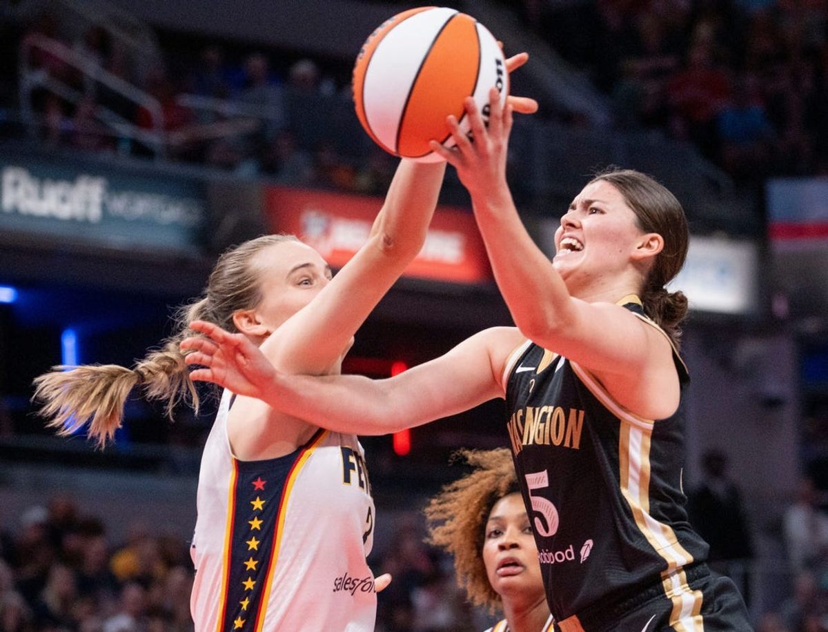 Indiana Fever guard Kristy Wallace (3) scrambles for the ball against Washington Mystics guard Jade Melbourne (5)
Wednesday, June 19, 2024, during the game at Gainbridge Fieldhouse in Indianapolis.