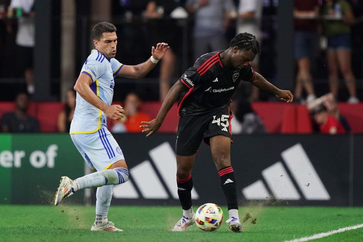 Jun 19, 2024; Washington, District of Columbia, USA; Atlanta United forward Daniel Rios (19) and D.C. United defender Matai Akinmboni (45) battle for the ball in the first half at Audi Field. Mandatory Credit: Amber Searls-USA TODAY Sports