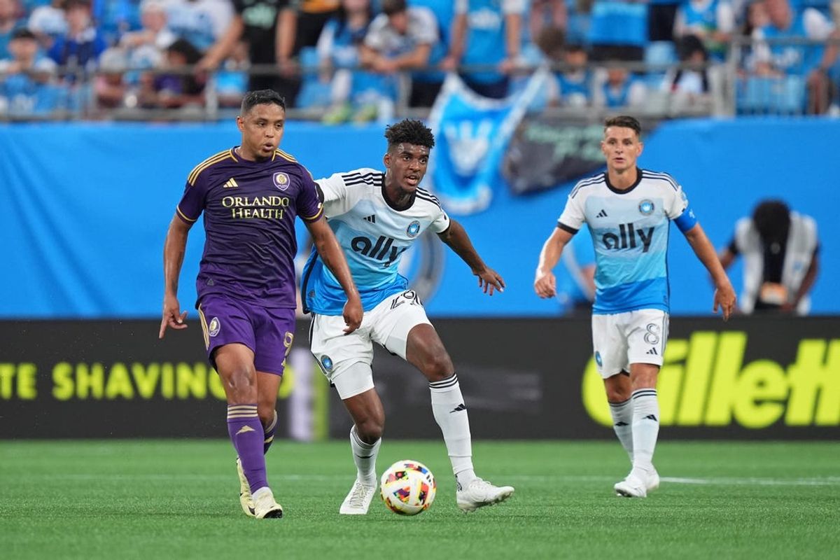 Jun 19, 2024; Charlotte, North Carolina, USA; Orlando City forward Luis Muriel (9) dribbles the ball against Charlotte FC defender Adilson Malanda (29) during the first half at Bank of America Stadium. Mandatory Credit: Jim Dedmon-USA TODAY Sports