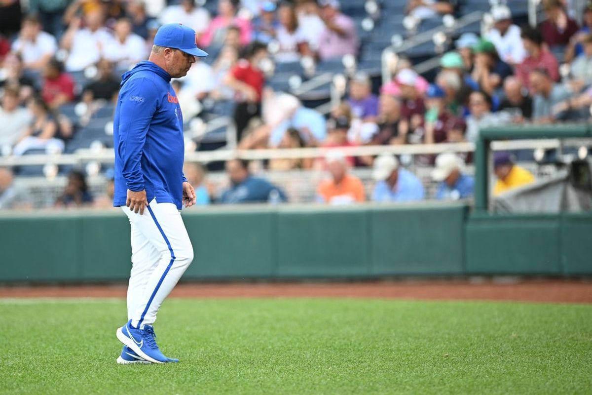 Jun 19, 2024; Omaha, NE, USA;  Florida Gators head coach Kevin O'Sullivan walks off the mound during the game against the Texas A&M Aggies during the first inning at Charles Schwab Field Omaha. Mandatory Credit: Steven Branscombe-Imagn Images