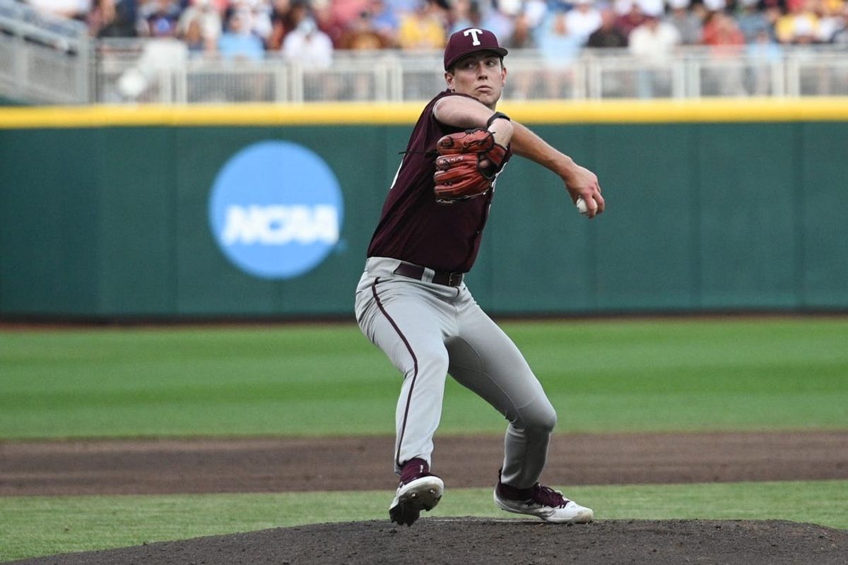 Jun 19, 2024; Omaha, NE, USA;  Texas A&M Aggies starting pitcher Justin Lamkin (33) throws against the Florida Gators during the third inning at Charles Schwab Field Omaha. Mandatory Credit: Steven Branscombe-USA TODAY Sports