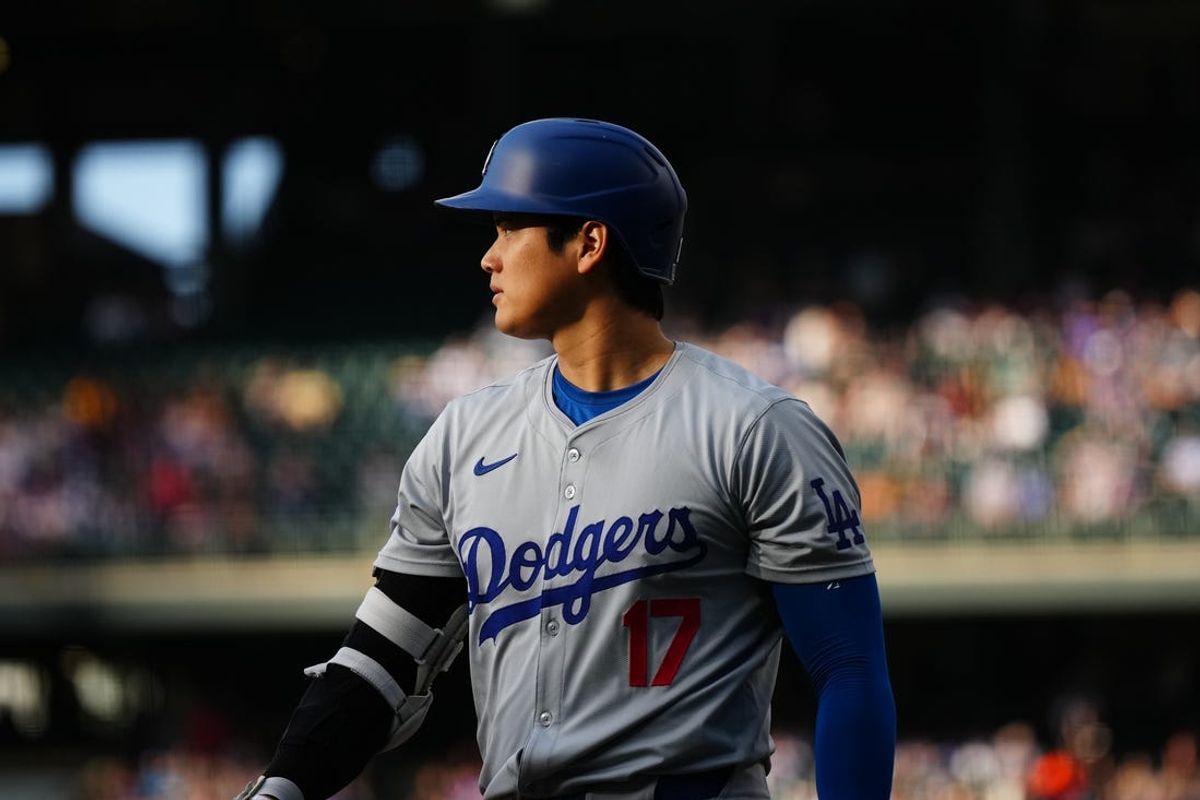 Jun 19, 2024; Denver, Colorado, USA; Los Angeles Dodgers designated hitter Shohei Ohtani (17) following his fly ball out in the first inning against the Colorado Rockies at Coors Field. Mandatory Credit: Ron Chenoy-USA TODAY Sports